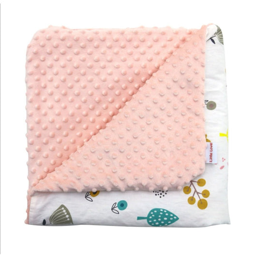 Woodland Animals car seat blanket for a 5-point harness, folded to show the patterned cotton and peach minky sides