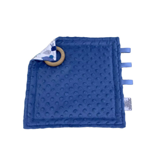 Wild One taggie, blue minky side with ribbon tags and a wooden ring