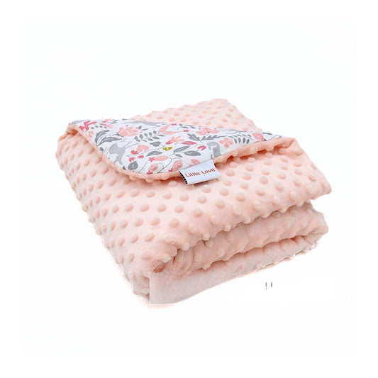 Little Deer car seat blanket for a 5-point harness, folded to show the patterned cotton and peach minky sides
