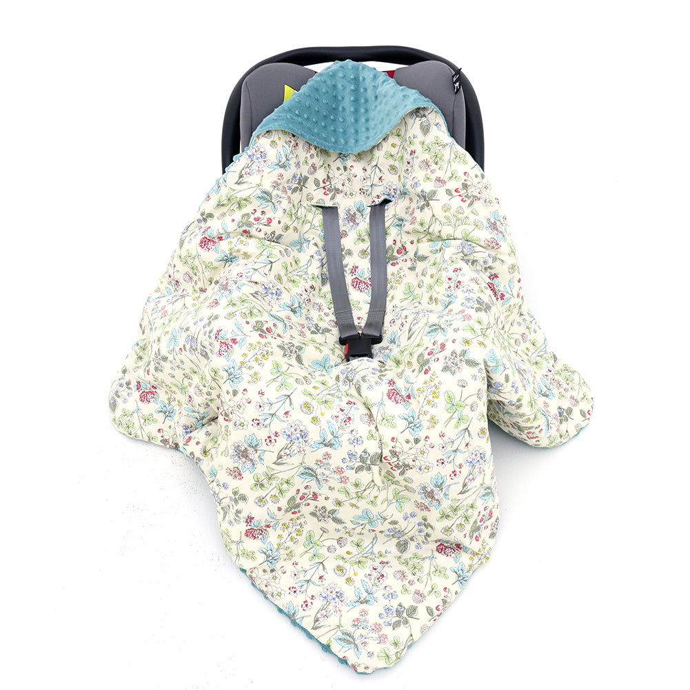 Wildflower car seat blanket for a 3-point harness, patterned side out, fitted over an infant car seat