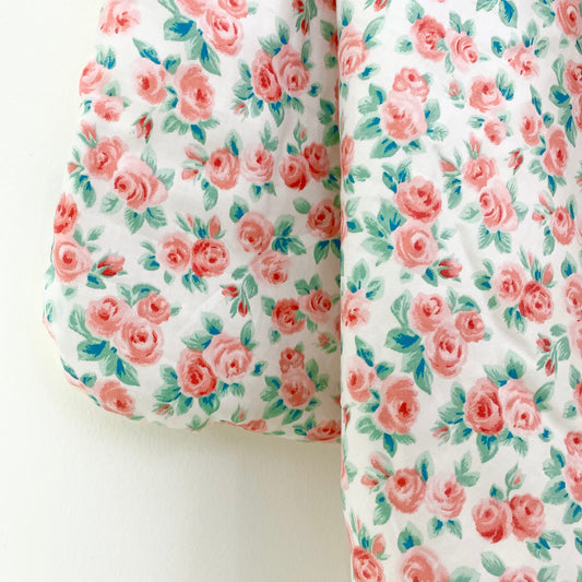 Rose car seat blanket for a 3-point harness, close-up of the patterned cotton print