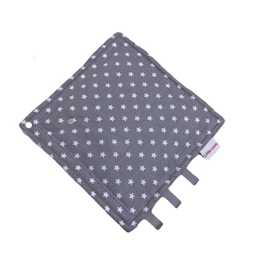 Grey Star taggie, patterned cotton side with ribbon tags and a wooden ring