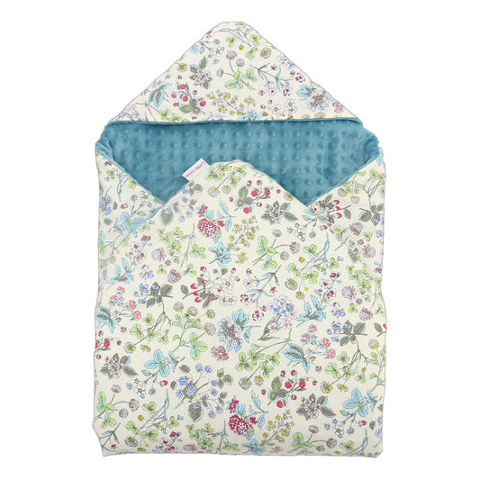 Wildflower car seat blanket for a 3-point harness, patterned side out, folded with the teal minky hood