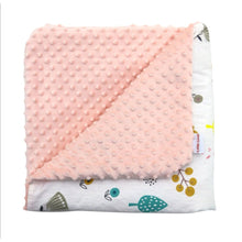 Load image into Gallery viewer, Woodland Animals car seat blanket for a 5-point harness, folded to show the patterned cotton and peach minky sides