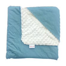 Load image into Gallery viewer, Teal Spot car seat blanket for a 5-point harness, folded to show the patterned cotton and cream minky sides