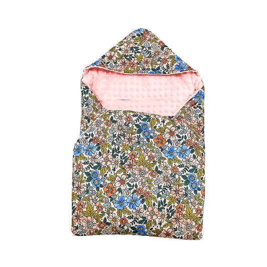 Eleanor car seat blanket for a 5-point harness, patterned side out, folded with the pink minky hood