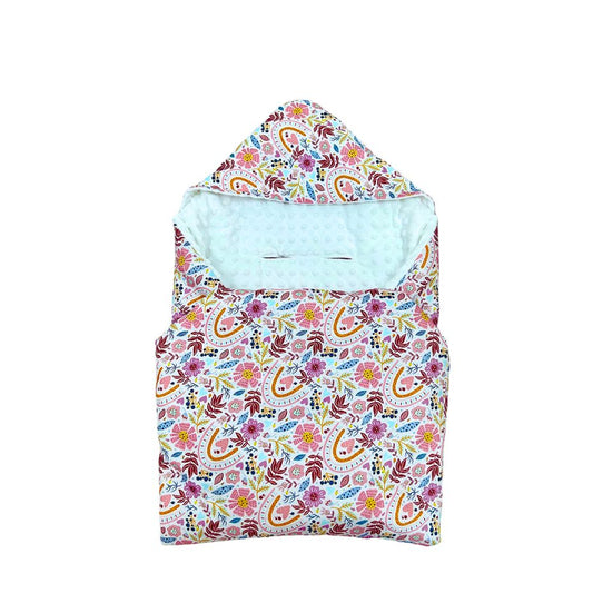 Rainbow car seat blanket for a 5-point harness, patterned side out, folded with the white minky hood
