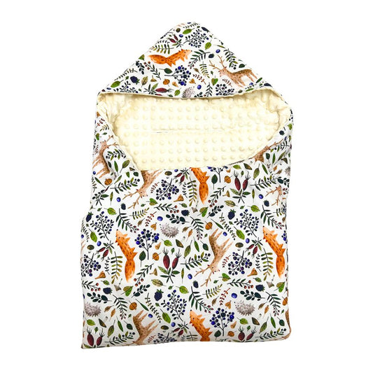 Bramble car seat blanket for a 5-point harness, patterned side out, folded with the cream minky hood