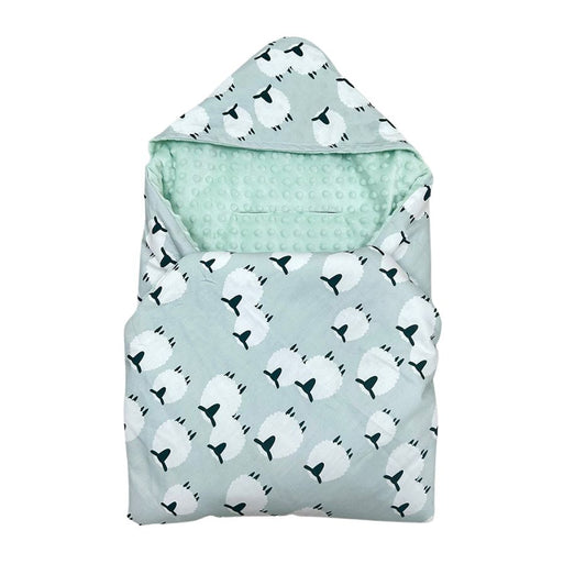 Wee Lamb car seat blanket for a 5-point harness, patterned side out, folded with the mint minky hood