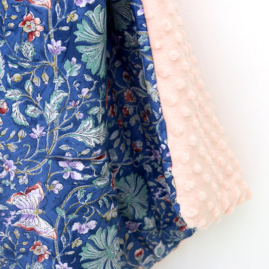 Navy and Pink Wildflower infant snuggle blanket, close-up of the patterned cotton and pink minky fabrics