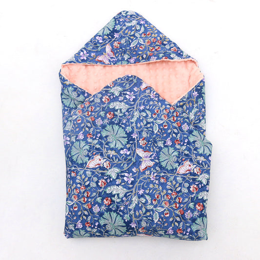 Navy and Pink Wildflower toddler blanket, patterned side out, folded with the pink minky hood
