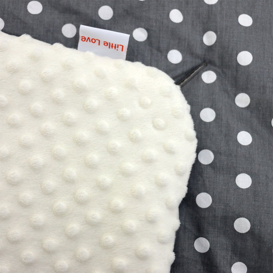 Grey and White Spot car seat blanket for a 5-point harness, close-up of the patterned cotton and cream minky fabrics