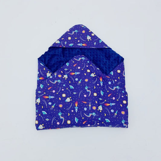 Rocketman toddler blanket, patterned side out, folded with the navy minky hood