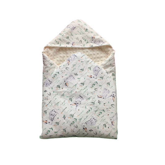 Grey Hare car seat blanket for a 3-point harness, patterned side out, folded with the cream minky hood