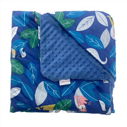 Blue animals car seat blanket for a 3-point harness, folded to show the patterned cotton and blue minky sides