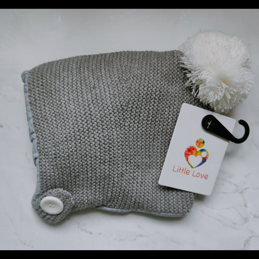 Dark Grey hat, knitted bonnet with a pom-pom and button strap, with its Little Love tag